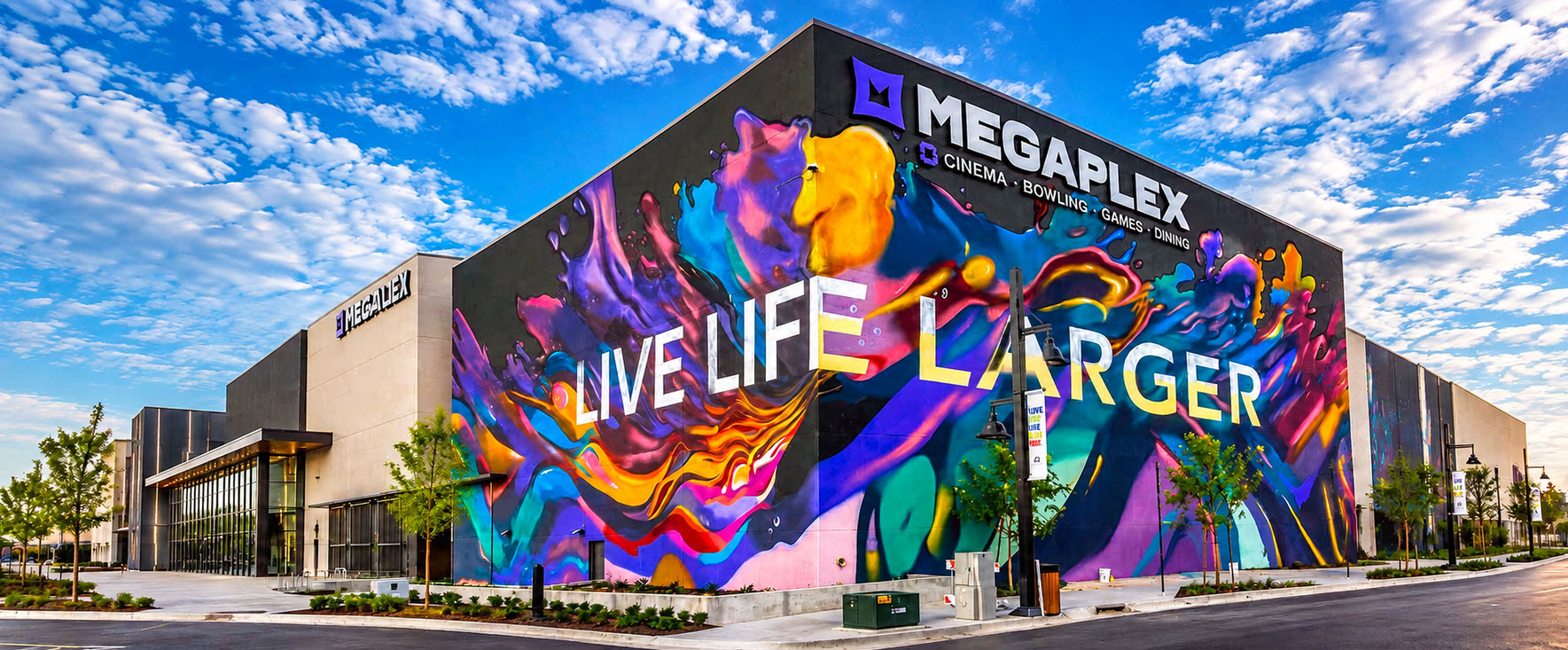 Megaplex Daybreak exterior with the Live Life Larger mural